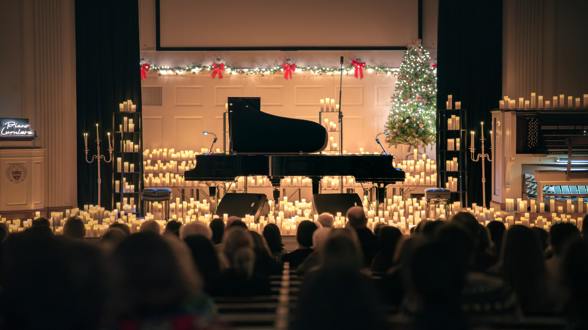 The Piano Lumière stage, lit with candlelight